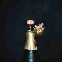 Free photo opening bottle of champagne