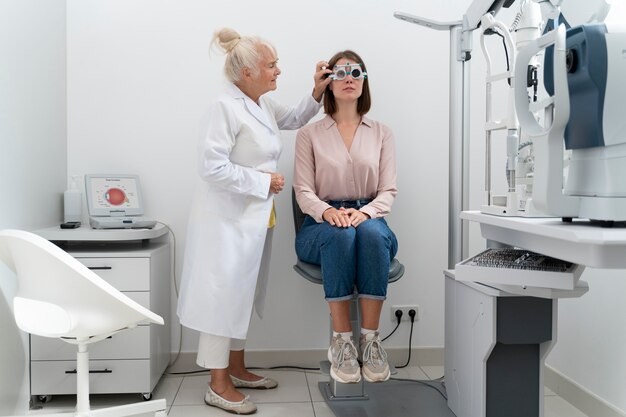 Ophthalmologist checking a patient in her clinic