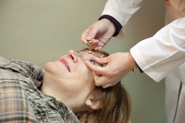 Ophthalmologist measures the  ocular tension