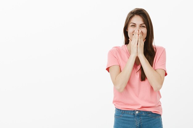 Optimistic brunette woman posing in the studio