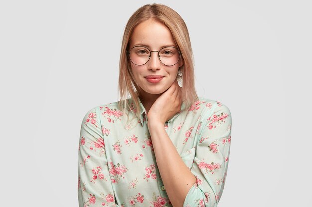 Optimistic Caucasian young female blogger with attractive appearance