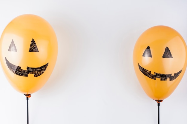 Orange balloons painted as pumpkins 