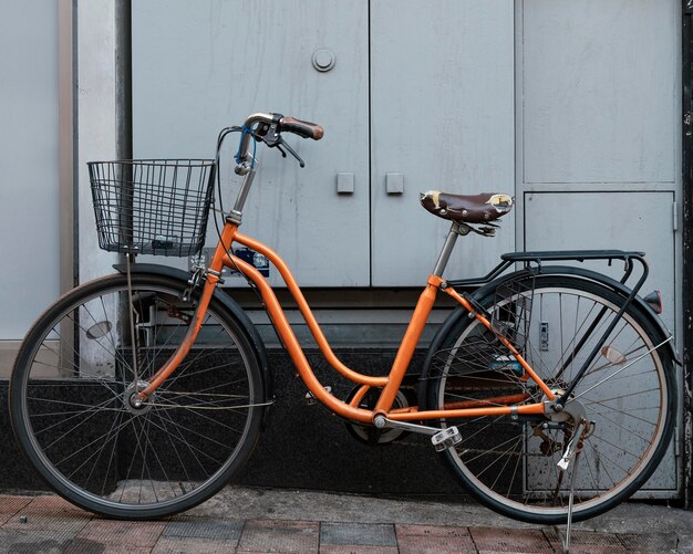 Orange bicycle with basket