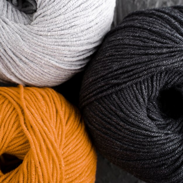 Orange, black and white wool yarn