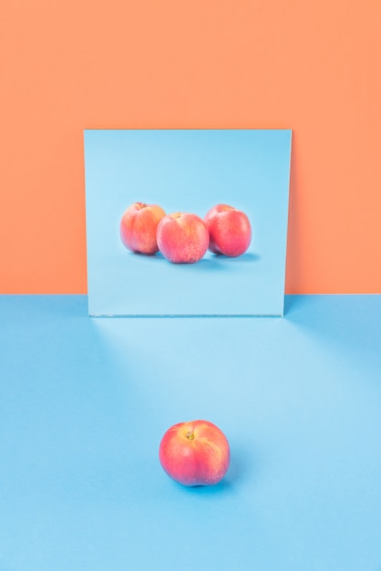 Orange on blue table isolated on orange