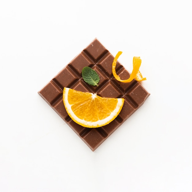 Orange on chocolate bar top view