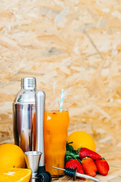 Orange cocktail and tropical fruits