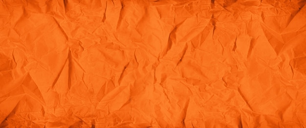 Orange crumpled paper texture background