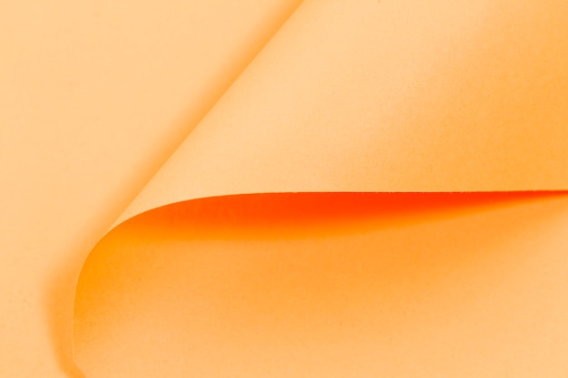 Orange curly pages texture with copy space