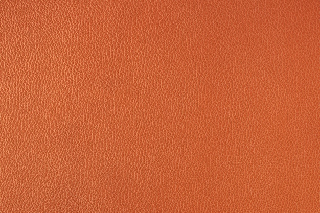 オレンジ色の上質な革の織り目加工の背景
