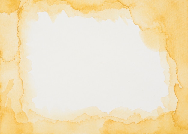 Free photo orange frame of paints on white sheet