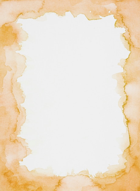 Free photo orange frame of paints on white sheet