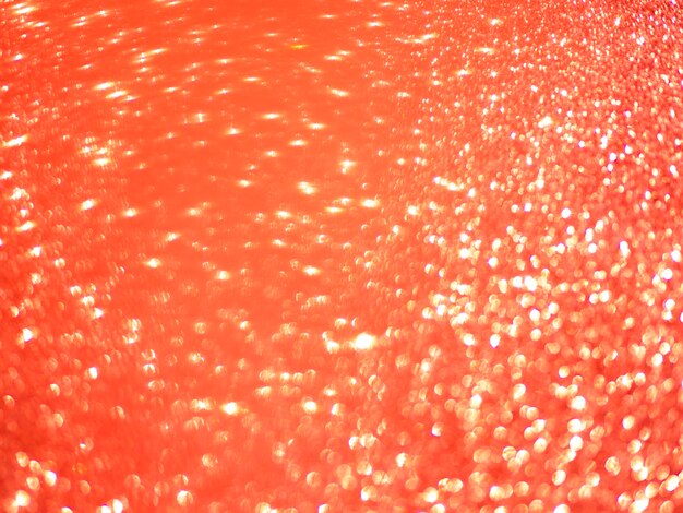 Orange glitter wallpaper background