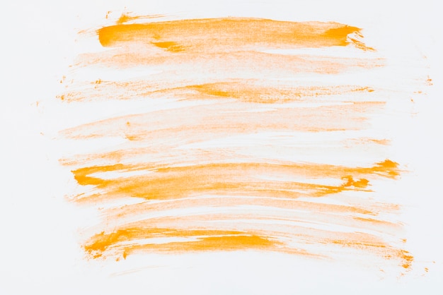 Free photo an orange hand drawn watercolor brush stroke