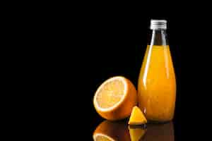 Free photo orange juice on black background