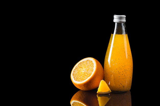 orange juice on black background