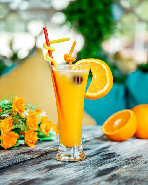 Orange juice garnished with orange slice