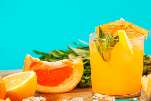 Orange juice and pieces of citrus fruits