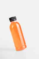 Free photo orange juices bottle mock up blank using for beverage template