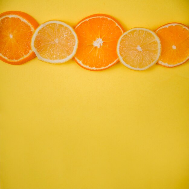 Orange and lemon slices with space