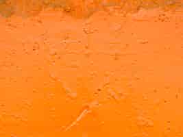 Free photo orange painted textured surface