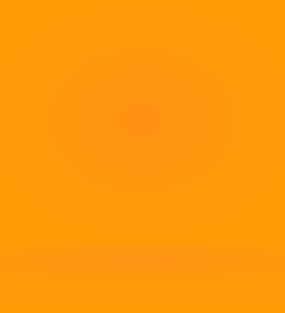 Free photo orange photographic studio background vertical with soft vignette soft gradient background painted c...