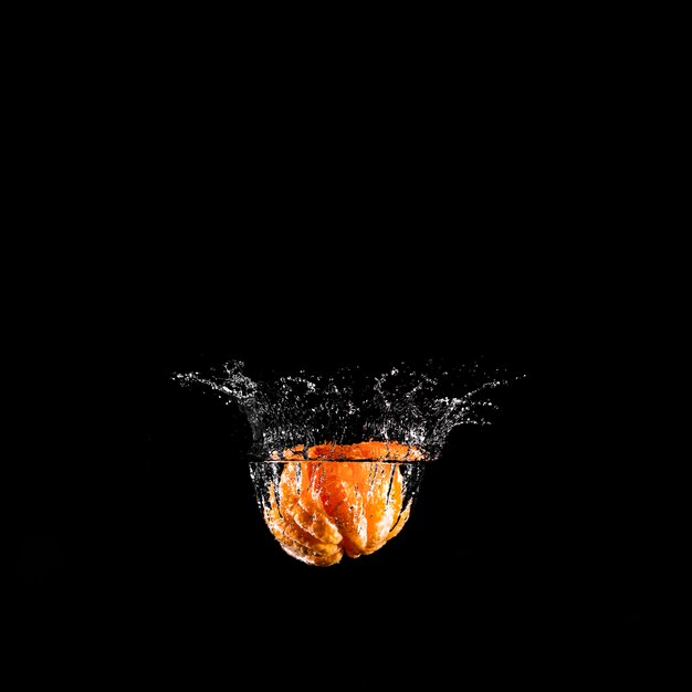 Orange plunging into the water