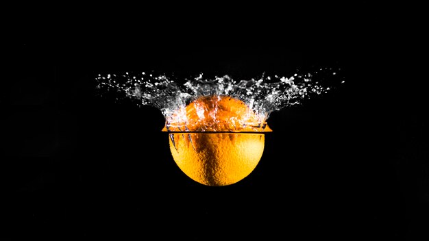 Orange plunging into the water