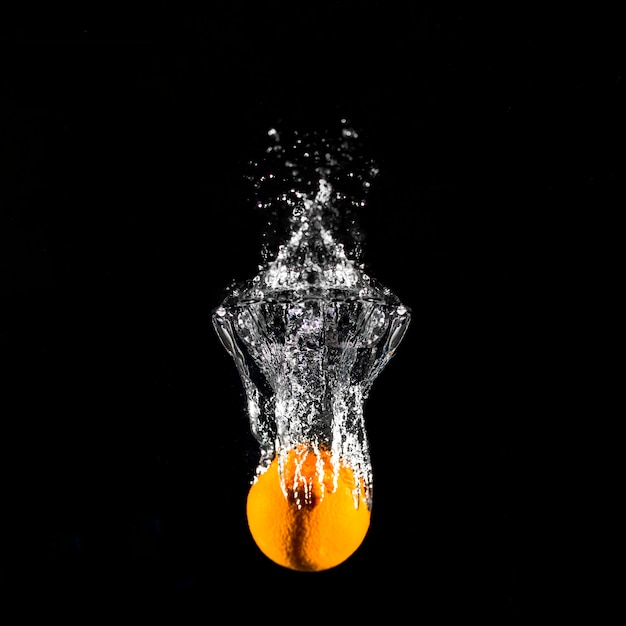 Orange plunging into the water