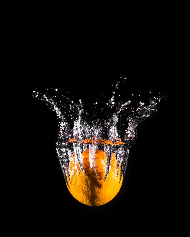 Free Photo orange plunging into the water