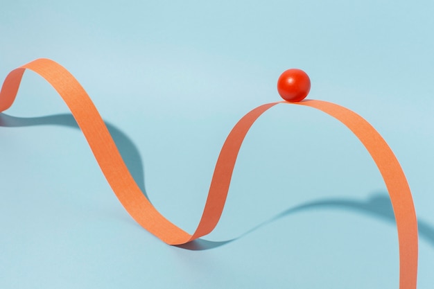 Orange ribbon with ball