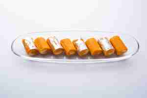 Free photo orange roll barfee or barfi sweet or mitlai