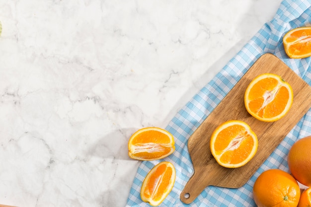 Orange slices on chopping board with copy space