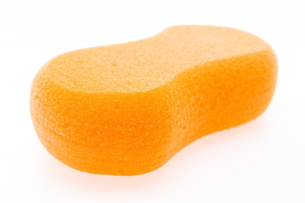 Orange sponge on white background