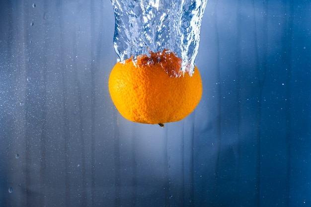 Orange thrown into the water