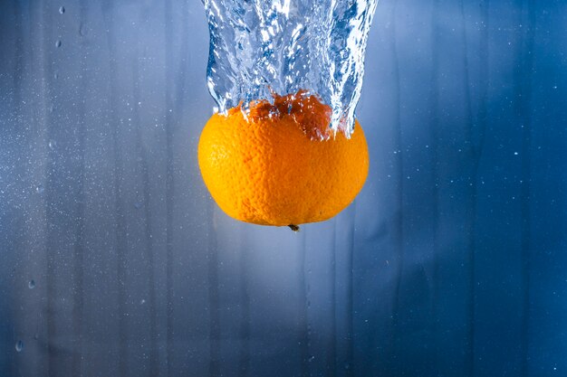 Orange thrown into the water