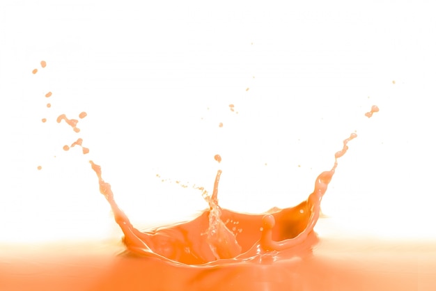 orange wine splash isolated on white