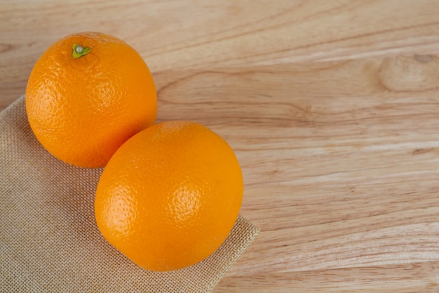 Orange on the wooden floor.