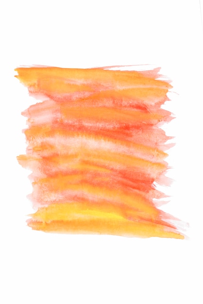 Free photo orange and yellow watercolor brush strokes on white paper