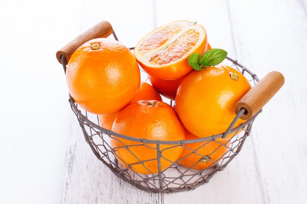 Oranges in a metal basket