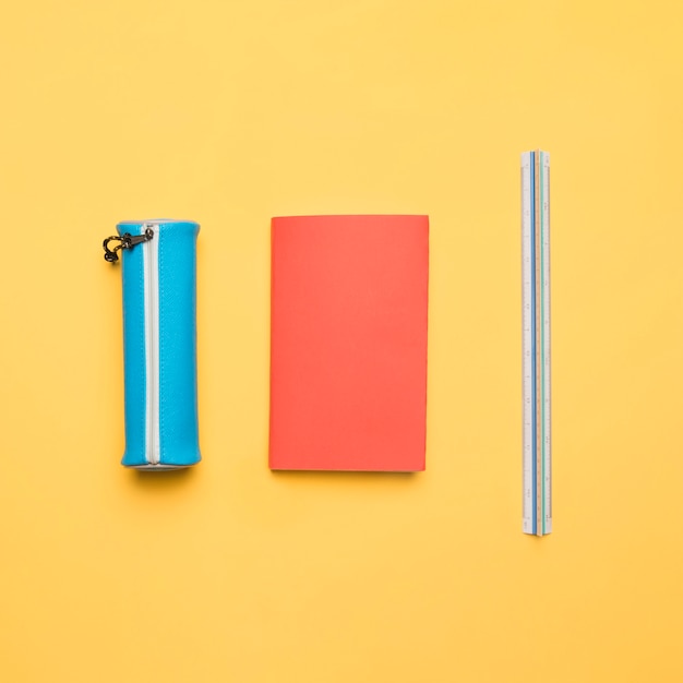 Free photo ordered set of colorful school supplies