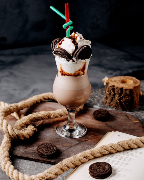 Orea milkshake with whipped cream chocolate sauce and orea