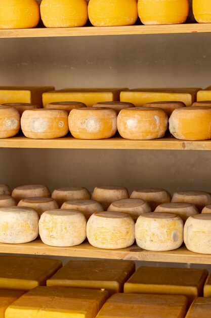 organic cheese wheels on shelf