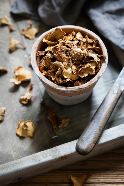 Organic dried chanterelle mushroom on wooden box