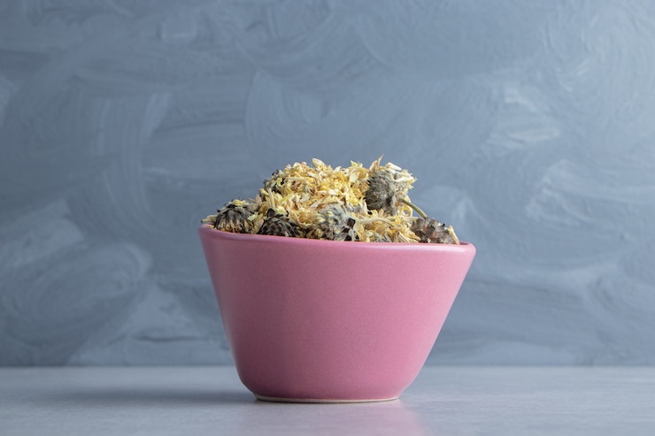Free Photo organic dried flowers in pink bowl