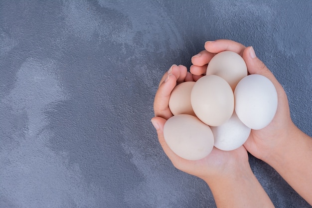 Organic eggs in the hand of a man.