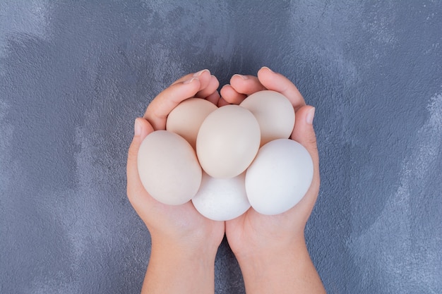 Organic eggs in the hands of a man