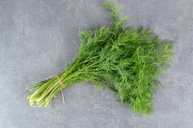 Organic fresh dill on marble backgroudn. High quality photo