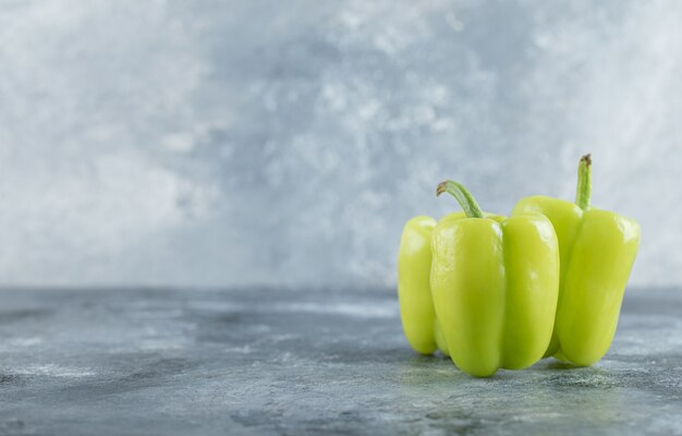 Organic fresh Green sweet pepper on grey background. High quality photo