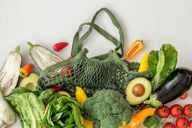 Organic fresh vegetables on white background flat lay